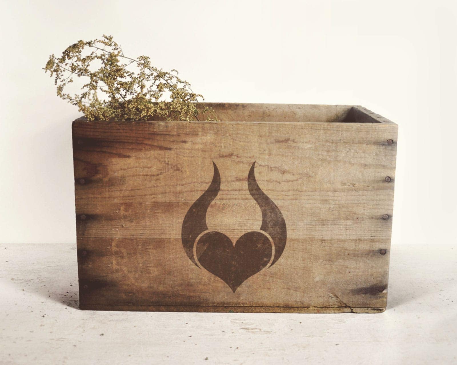 Solbacka logo printed on a wooden box